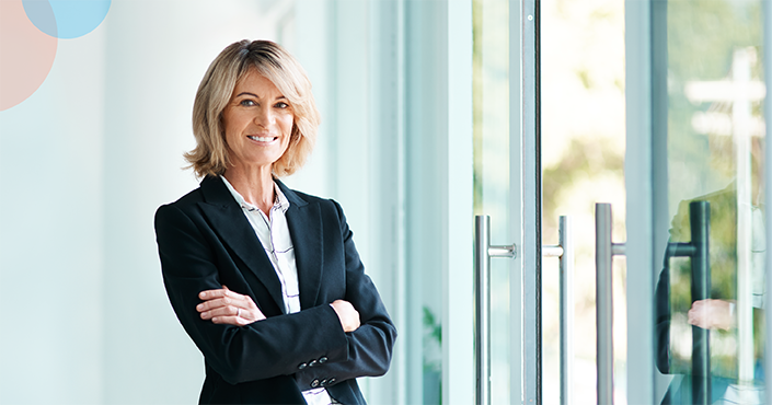 Business woman smiling with arms crossed