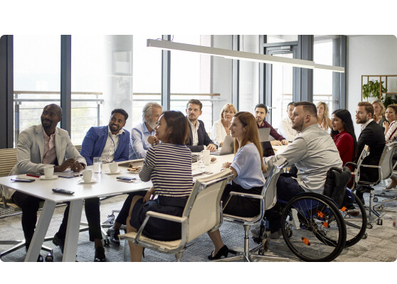 Professionals in a group meeting in an office | HealthStream