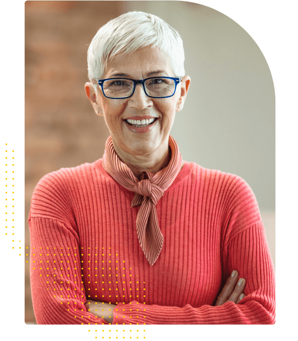 Women with short hair in an coral sweater