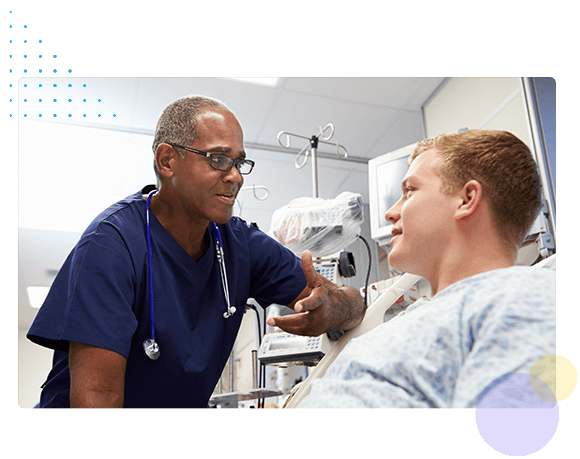 Healthcare professional taking care of patient in hospital bed