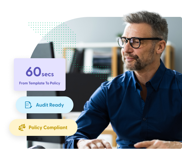 Male professional looking at desktop monitor smiling