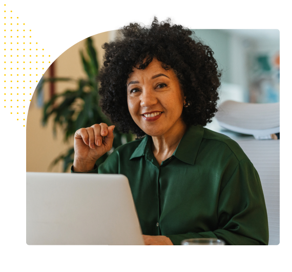 middle age professional women smiling with laptop