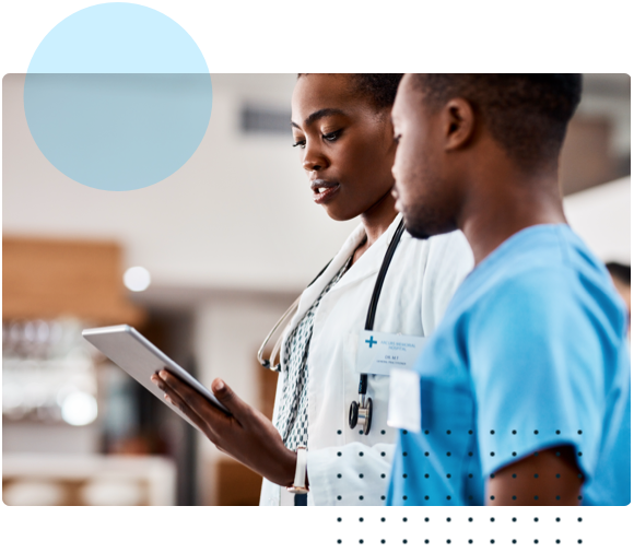 Two medical professionals looking at tablet
