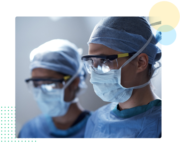 Two healthcare providers with gowns and masks - HealthStream