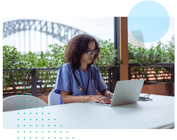 Medical professional working on a laptop - HealthStream Policy Manager
