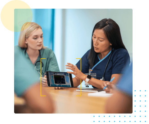 Medical professionals at a table - Resuscitation Specialty Sims HealthStream
